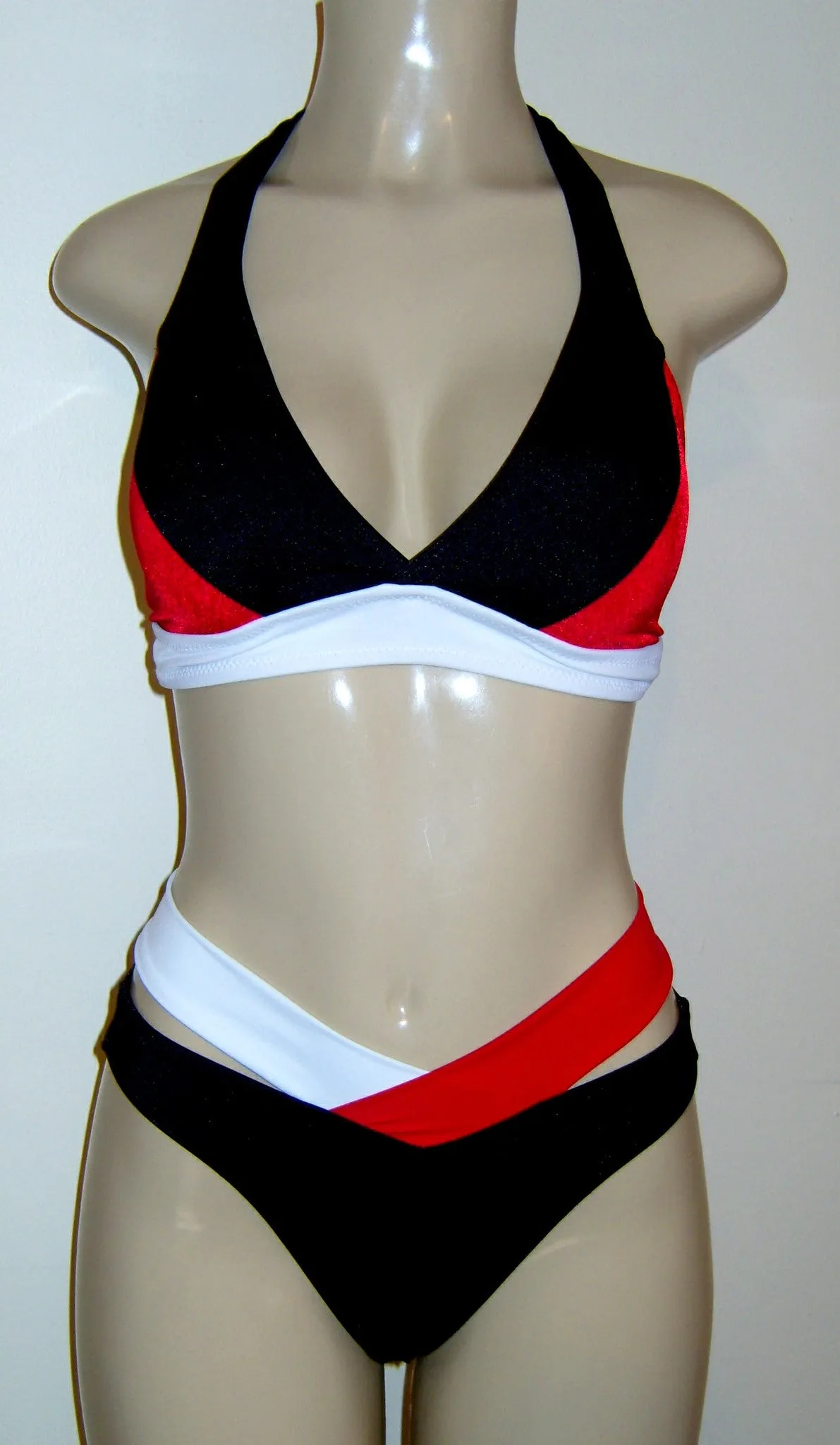 Halter bikini top and high waisted strappy bikini bottom