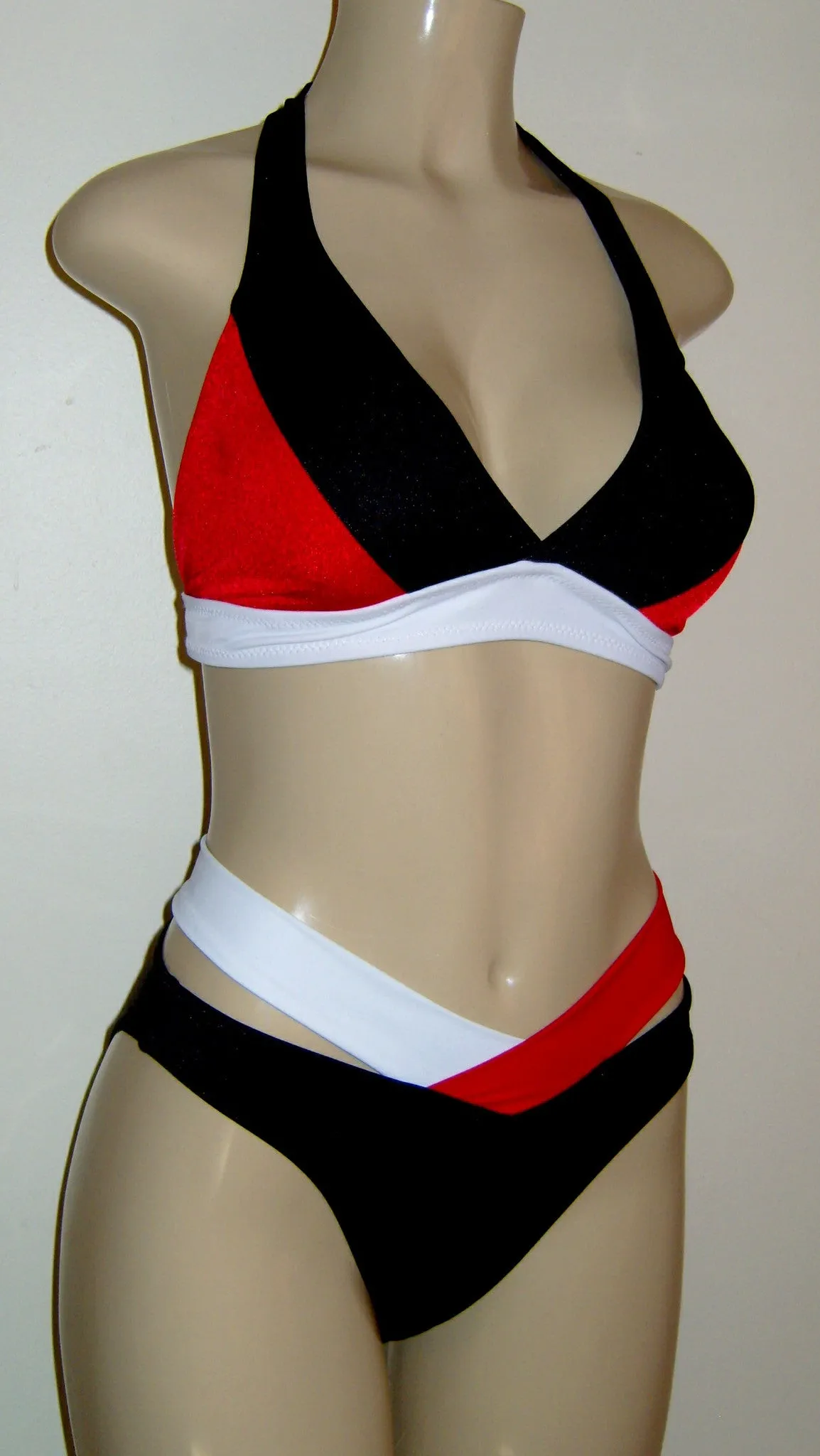 Halter bikini top and high waisted strappy bikini bottom